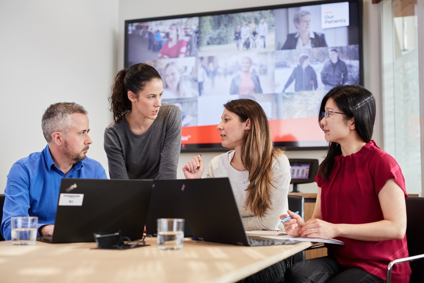 Three employees at desk