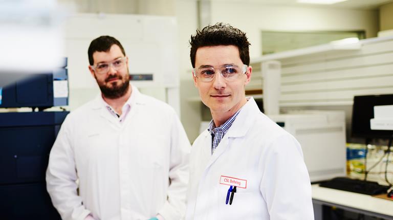 two researchers in white lab coats